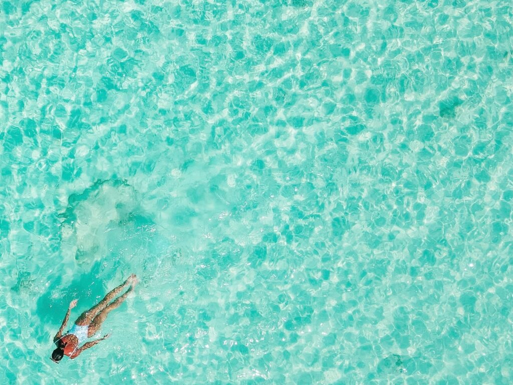 Overview of a woman swimming in clear water